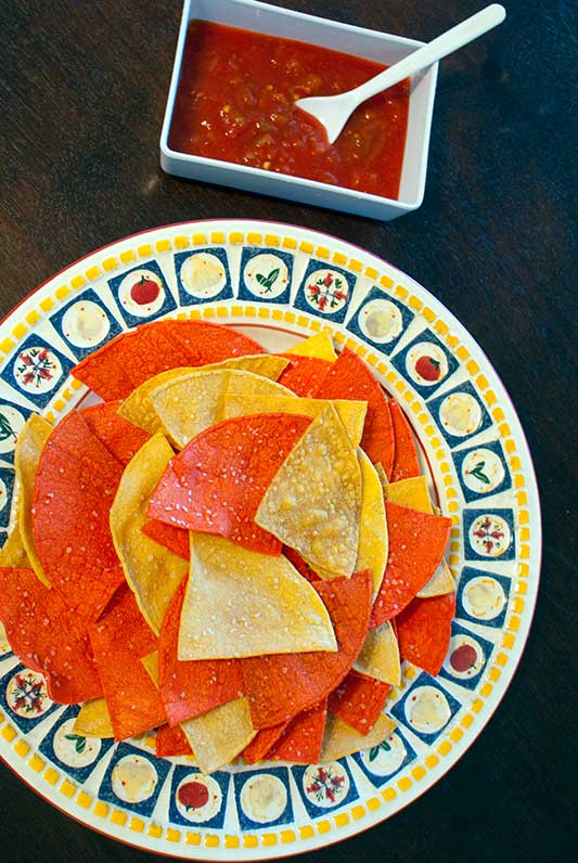 Baked tortilla chips are a simple and delicious snack that can be made in just minutes. Enjoy them hot with your favorite salsa.