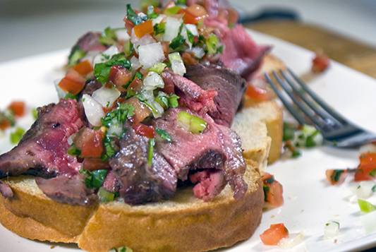 Pico de gallo over seared beef and toasted bread. Heavenly.