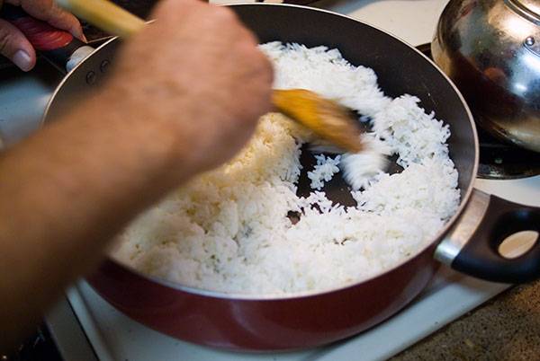 Frying the rice for bacon fried rice