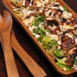 Chicken and field green salad with feta, almonds and raspberry vinaigrette