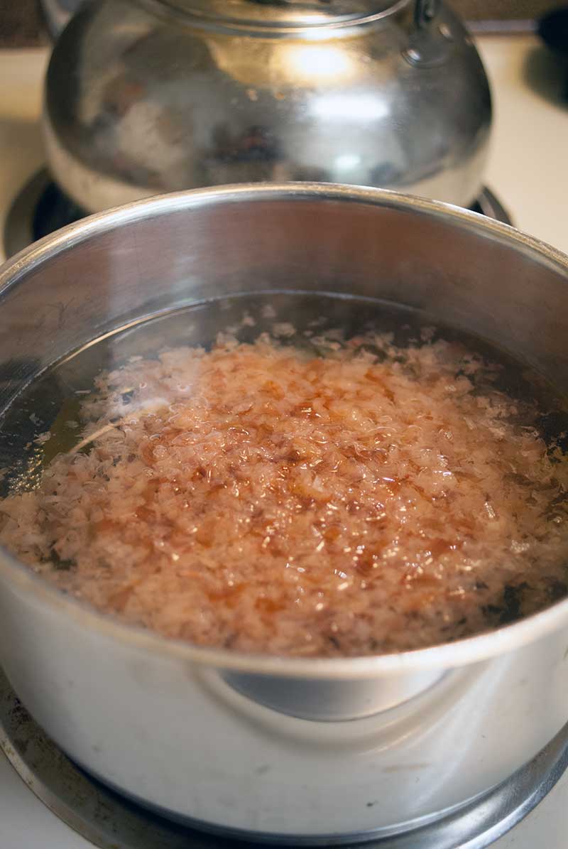 katsuoboshi (bonito flakes) steeping in hot water for making Dashi (Japanese Sea stock)