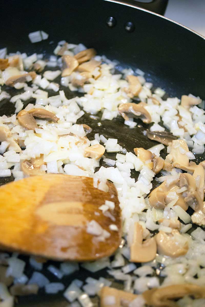 mushrooms and onions cooking for Grilled Turkey burgers with Garlic Mayo & Recaito