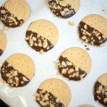 chocolate dipped cookies cooling on paper chocolate dipped cookies cooling on paper