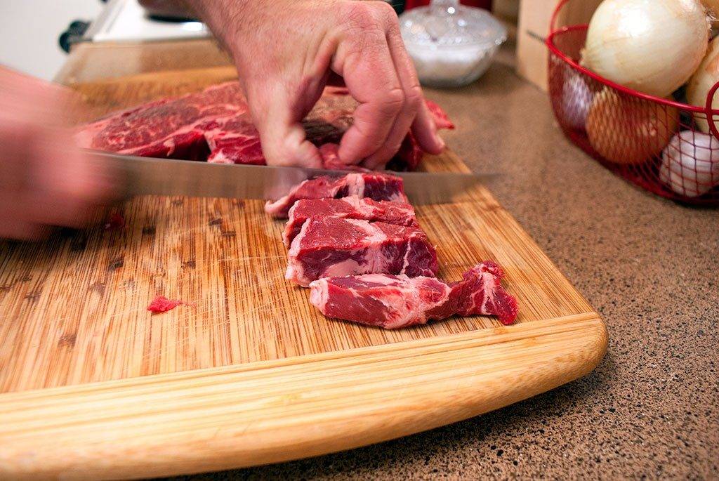 Cut beef into bite-sized pieces step one