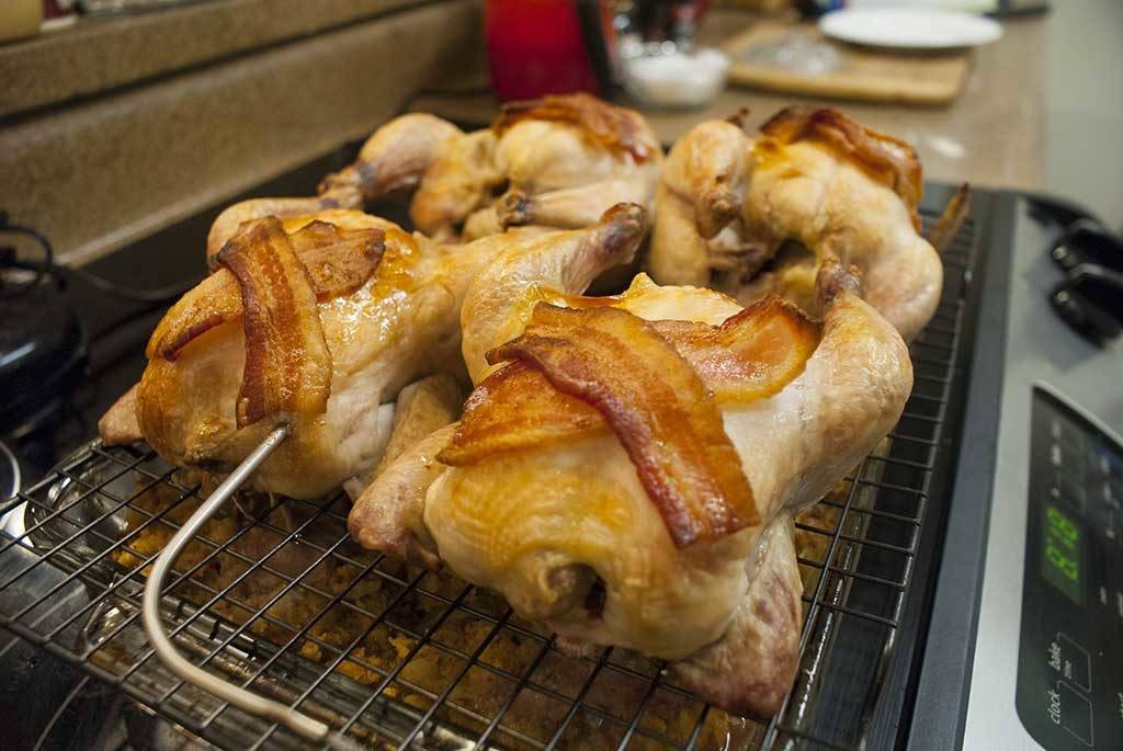 Cornish hens draped in succulent bacon. Served with traditional cornbread &sausage dressing. What could be better?