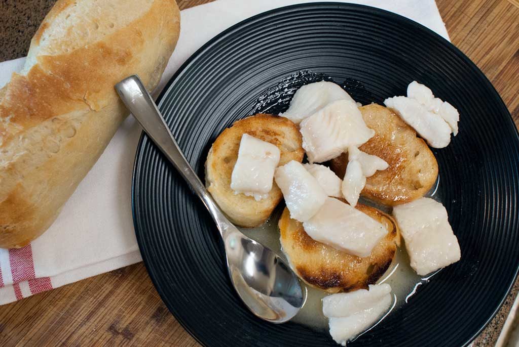Serve poached whitefish and sauce over soppettes