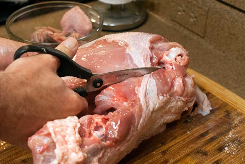 breaking down a turkey with kitchen shears - How to butcher a turkey series