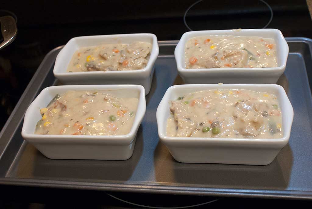 Mini loaf pans full to top with leftover turkey pot pie filling