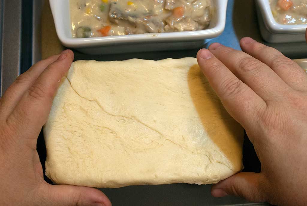 Covering baking dish with shaped crescent dough