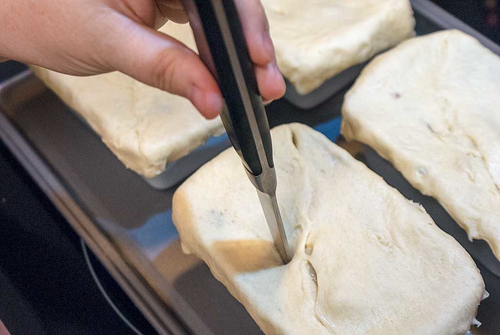 Cut slits in pie crust to allow steam to escape