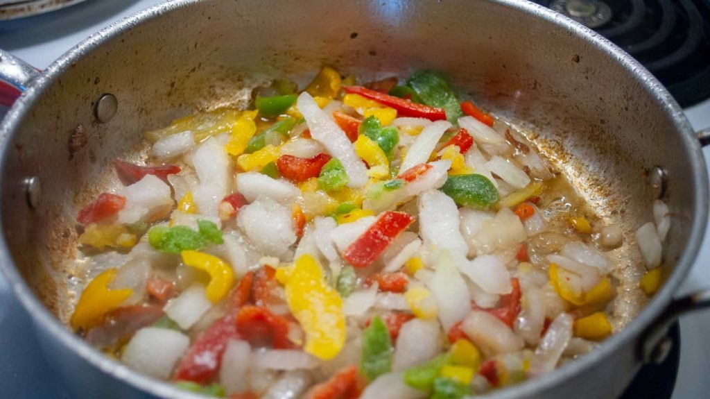 Pepper and onion blend in skillet