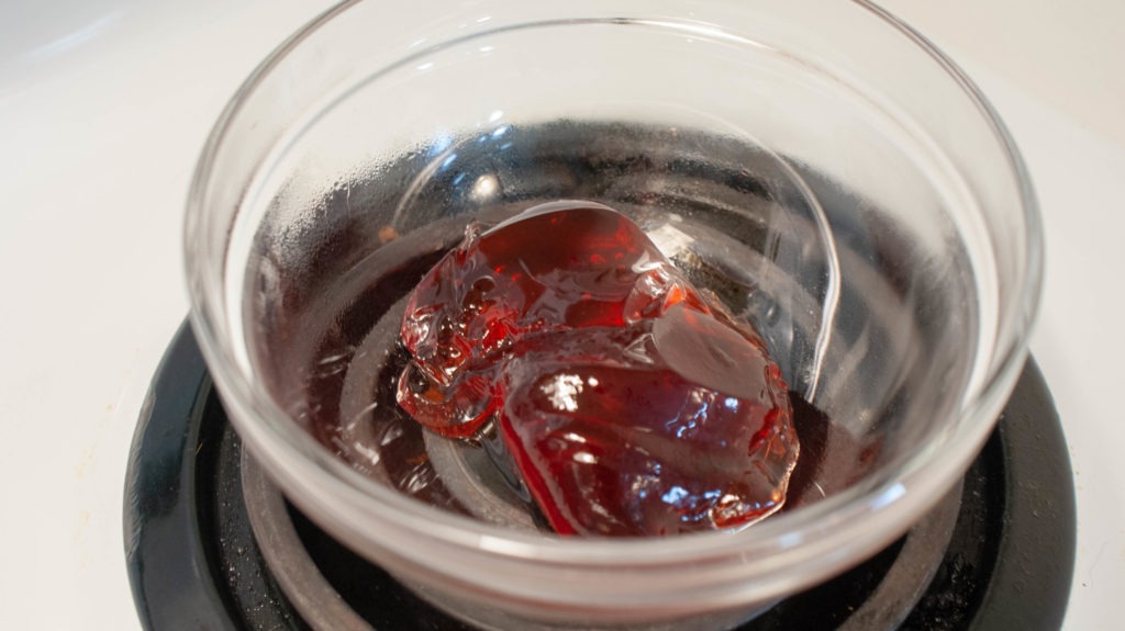 Plum jelly in a glass bowl