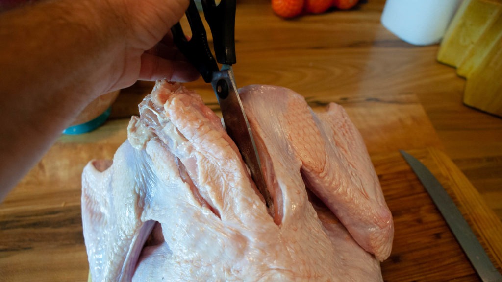 Cleaning the ribs off the backbone on a turkey