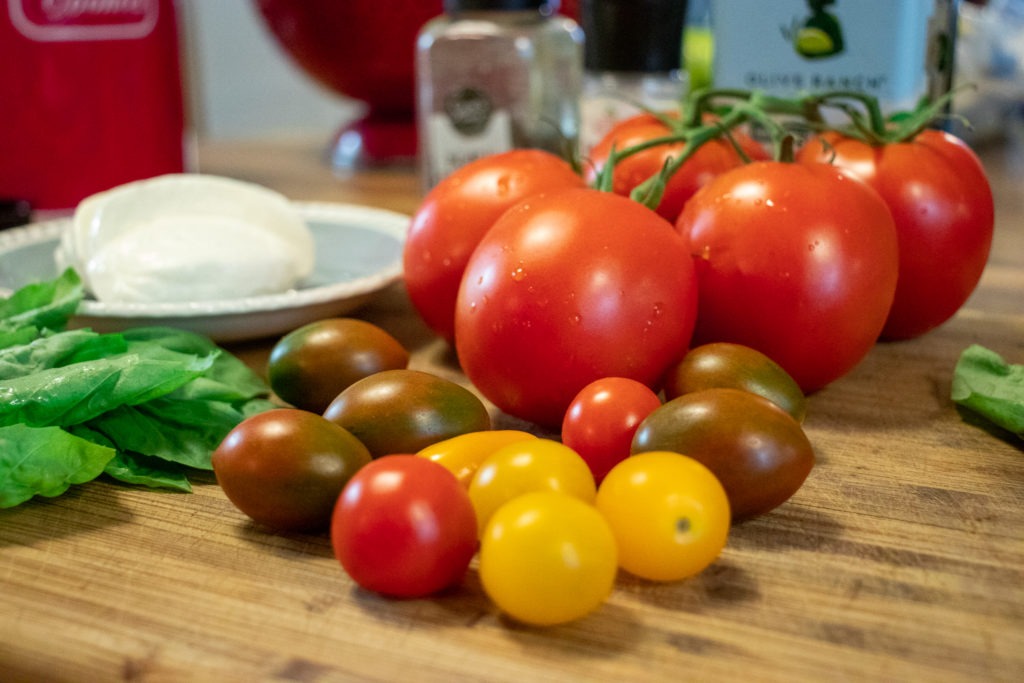 Fresh tomatoes, basil, and Mozzarella cheese for a Caprese salad