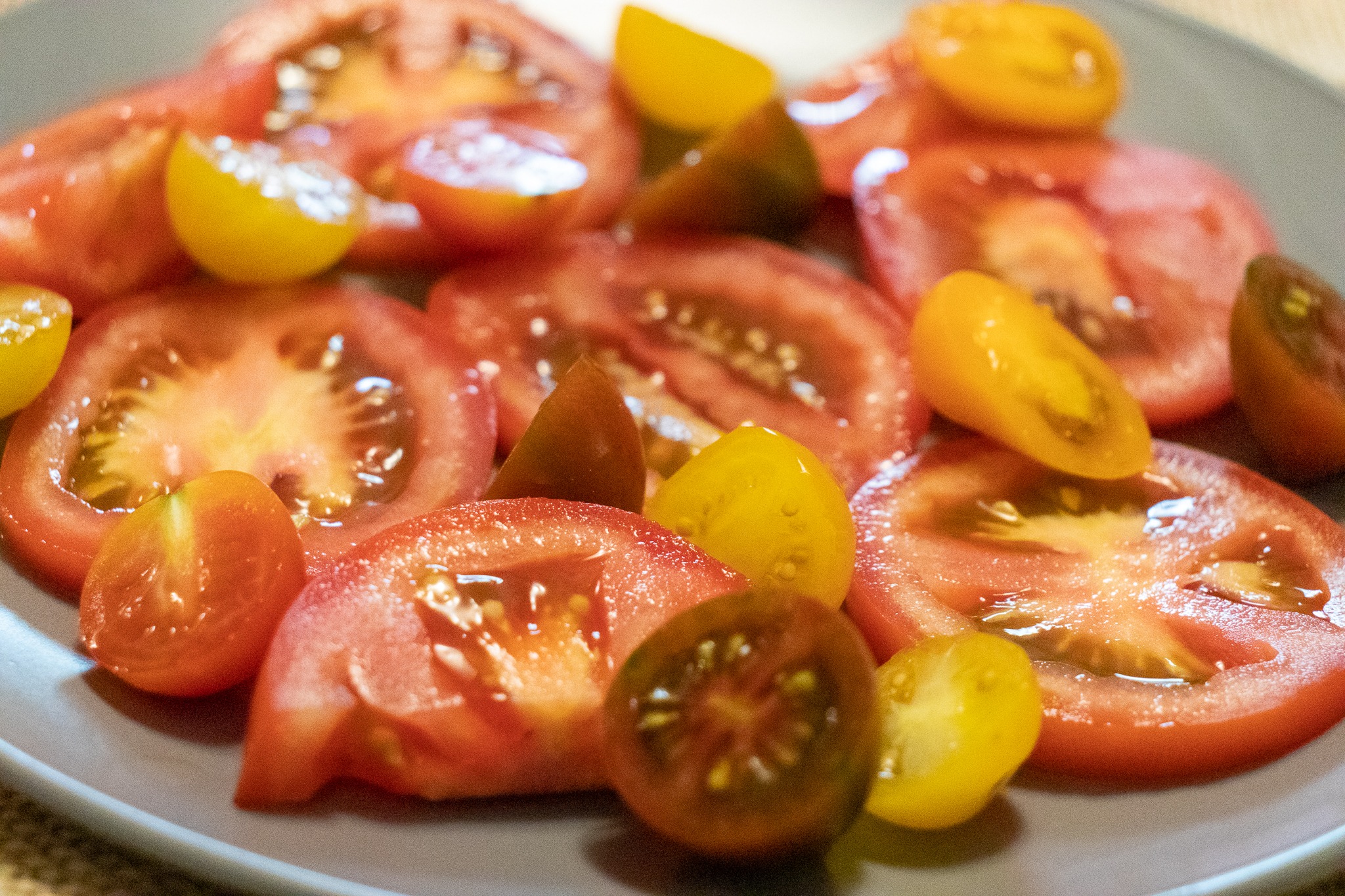 Sliced tomatoes arranged on a plate